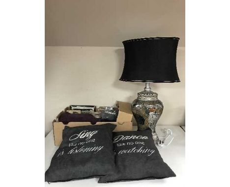 A box containing linen, cushions, leather place mats and coasters, wall hangings, together with a contemporary mosaic mirrore