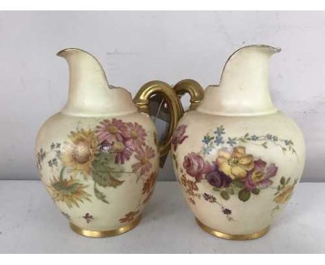 Two Royal Worcester blush ivory and gilded jugs, height 14 cm (one damaged) 