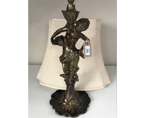 A patinated spelter figural table lamp with shade