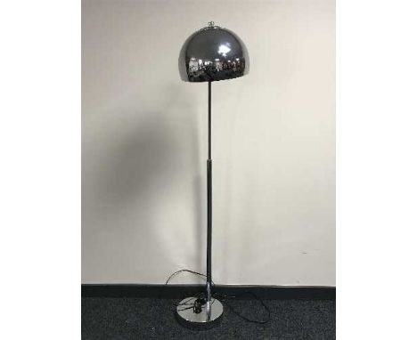 A chrome floor lamp
