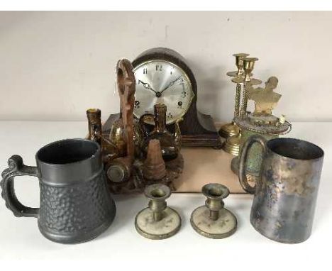 A tray containing oak mantel clock with silvered dial, pair of brass candlesticks, tankards, cigarette holder etc