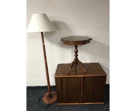 A teak effect double door cabinet together with an Italianate wine table and a teak G Plan standard lamp and shade