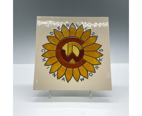 Beautiful heavy porcelain tile, features an orange sunflower with a symbol. DCW backstamp. Dimensions: 0.5''L x 6''W x 6''HCo