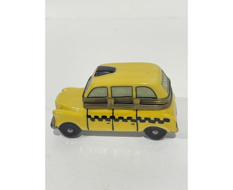 Nostalgic Yellow boxy taxi cab with metallic accents hand painted porcelain keepsake box. Detailed with top light, grill and 