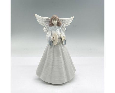 Glazed porcelain figure of a young lady angel in a white dress with blue accents holding cymbals. Lladro backstamp. This item