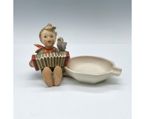 Also known as Let's Sing, this matte porcelain figural ashtray features a boy with an accordion and a singing bird. Goebel TM