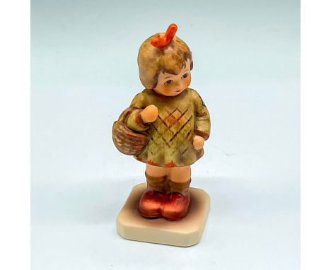 Little figurine in dress, carrying a basket. Hand painted in sage, orange and brown. Goebel and M.I. Hummel Club backstamp. 4