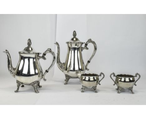 20th Century Silver Plated Heavy Duty 4 Piece Tea and Coffee Service, In Good Condition. Coffee Pot Stands 10.75 Inches High.