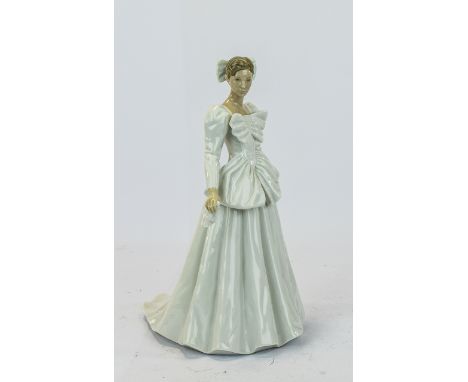 Nao By Lladro, young woman in long evening gown with a bow in her hair. Height 11.5 inches.