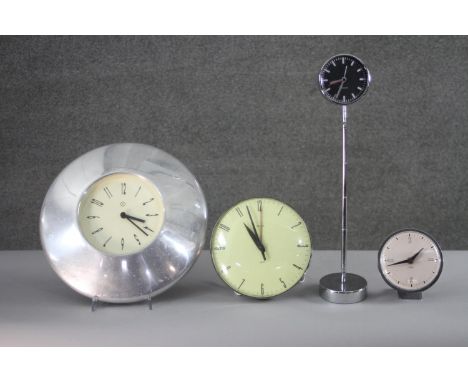 Four vintage clocks. One by Smiths with luminous dial and one on an adjustable chrome stand. Diam. 35 cm. (largest)