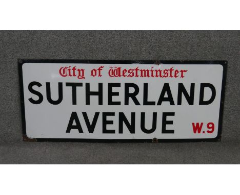 A vintage enamelled iron street sign for Sutherland Avenue, City of Westminster, with iconic and black and red sans serif let