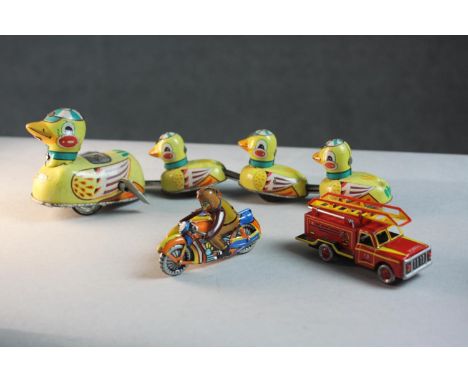 A collection of three vintage tin plate toys. Including a Blic duck family wind up toy with key along with two German ZZ wind