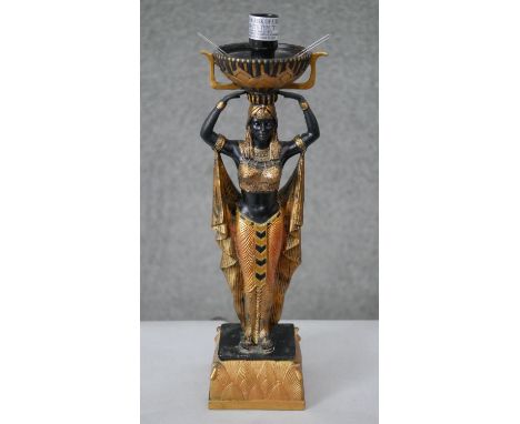 A gilded and painted resin lamp in the form of an Egyptian goddess. H.40 W.13cm 