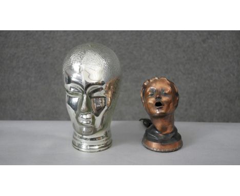A blown glass head mannequin along with a copper light in the form of a female head. H.25 W.17 D.20cm 