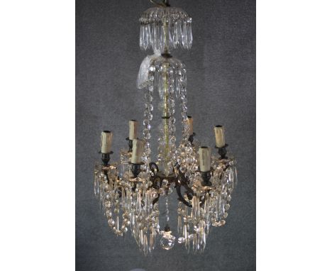 A vintage cut crystal and brass six branch chandelier with crystal swags and faceted ball to the bottom. 
H.77 W.50 cm 