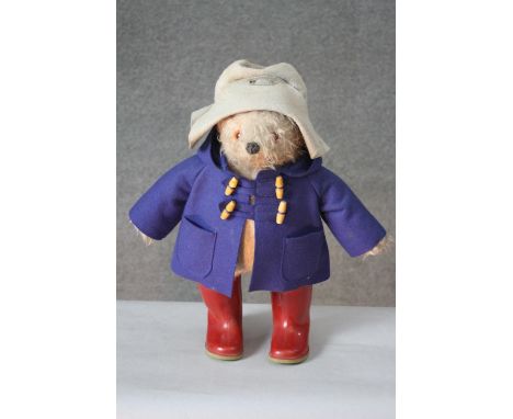 A Vintage Gabrielle Designs Paddington Bear with original label and red Dunlop wellington boots.
H.51 W.46 cm. 