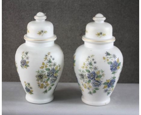 A pair of vintage frosted milk glass floral design lidded jars converted into table lamps. H.46 Diam. 23cm 