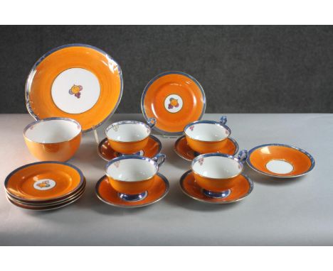 An Art Deco five person Gloria lustre porcelain orange fruit design part tea set (one cup missing). Including four cups and s