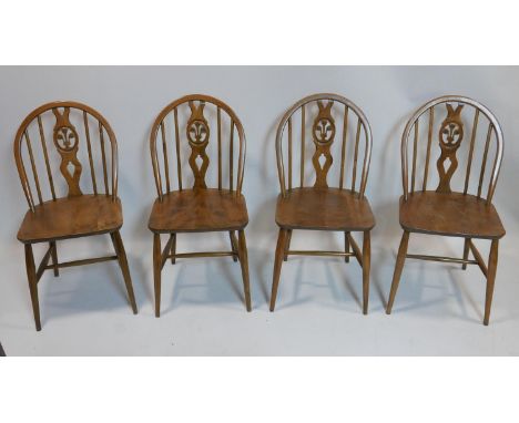 A set of four elm Ercol chairs 