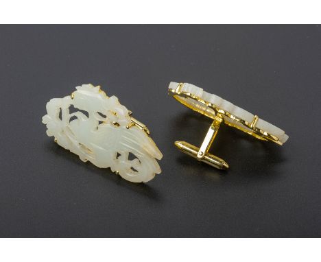 A PAIR OF CARVED JADE AND GOLD CUFFLINKS The pierced jade panels carved as a phoenix, mounted in 14k gold Marked '14k' to rev