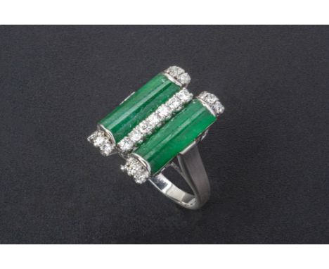 A JADE AND DIAMOND RING
Set in 18k white gold, the rectangular jade panels split with a row of round brilliant cut diamonds (