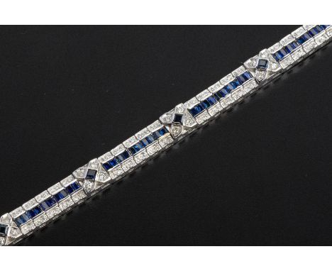 AN ART DECO STYLE SAPPHIRE AND DIAMOND BRACELET
Set in unmarked white gold, the articulated links set with a central channel 