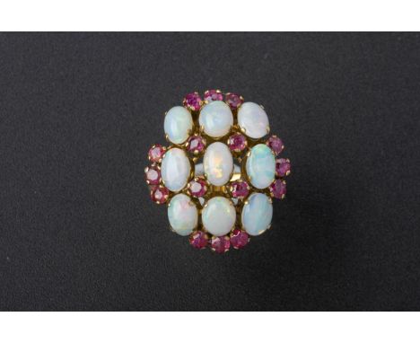 AN OPAL AND RUBY COCKTAIL RING
Set in 18k gold
Marked '18k'
US size 8.5
4.5g
Condition: For a condition report or further ima