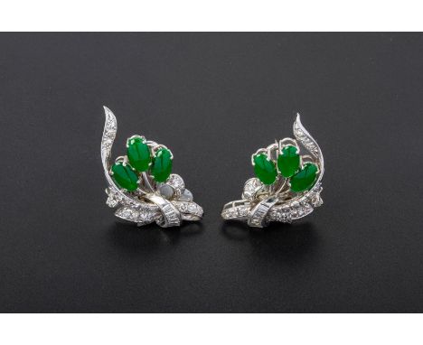 A PAIR OF JADE AND DIAMOND EARRINGS
Set in 18k white gold, with three cabochon jades within a round brilliant cut and baguett