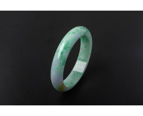 A TYPE A JADEITE BANGLE
Accompanied with a Nan Yang Gemological Institute Certificate No. 16817548 dated 22 September 2022 st