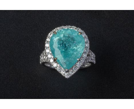 A PARAIBA TOURMALINE AND DIAMOND CLUSTER RING Set in 18k white gold, the pear shaped Paraiba tourmaline within a surround of 