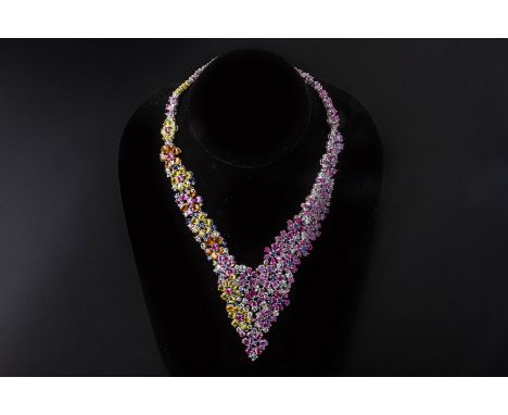 A SAPPHIRE NECKLACE AND EARRINGS SET Set in unmarked white gold, the articulated design featuring yellow, orange, pink and bl