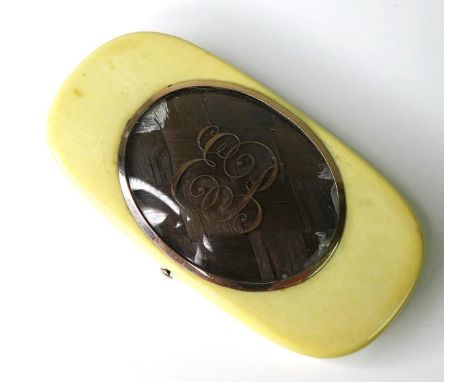 A Georgian ivory and gold set mourning patch box, inlaid with a panel of woven hair, the glass inscribed EB, the interior lin