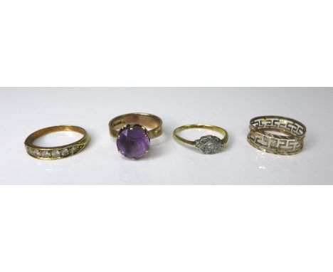 AMENDED DESCRIPTIONA group of four gold rings, comprising an&nbsp;18ct gold and platinum diamond nine stone ring, size N/O, 1