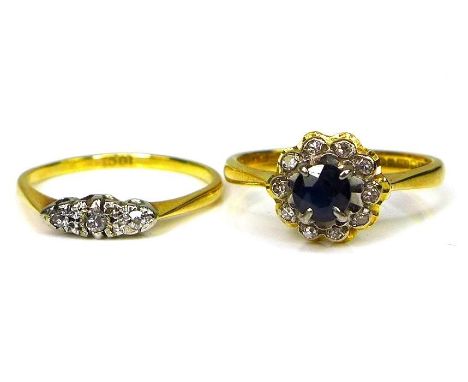 Two 18ct gold rings, one set with sapphires and diamond chips, the second illusion set with diamonds, size M and L respective