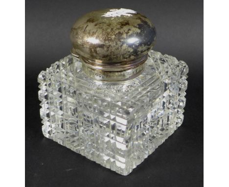 A Victorian silver topped cut glass perfume bottle, by Army &amp; Navy Cooperative Society Ltd, London 1890, with internal gl