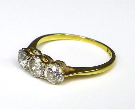 Private collection-Vintage and Modern design rings: An 18ct gold and diamond three stone ring, the central diamond of 0.3ct a