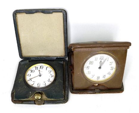 An early to mid 20th century Asprey eight day travel clock, contained within green leather case, together with a second vinta