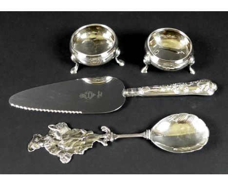 A pair of Georgian cauldron salts, three hoofed feet, a spoon with shell bowl and figural orange seller finial, and a Sheffie