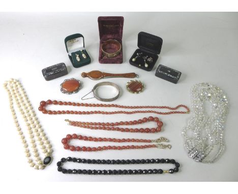 A quantity of costume jewellery, including a silver bangle, a silver charm, approximately 0.7toz, two pearl earrings, two sma