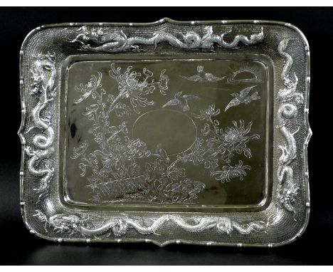 A Chinese export silver tray, late 19th century, of rectangular form, with central engraved decoration of birds, flowers and 
