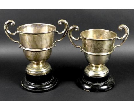 Two George V silver twin handled trophies, the first engraved 'Chertsey August Bank Holiday Sports, Abbey Cup, presented by H