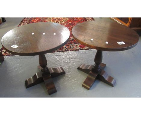 Pair of mid century circular oak lamp tables on shaped, quadraform base. (2) (B.P. 21% + VAT)&nbsp;Moderate ware and rear - s