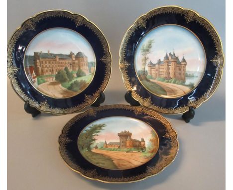 Set of three porcelain limoges cabinet plates, hand painted with architectural designs and with cobalt blue and gilded boarde