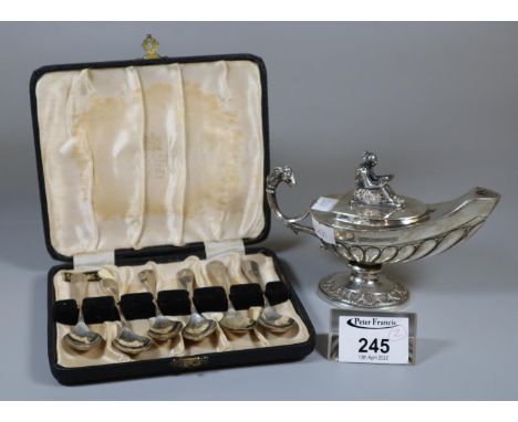 Set of six cased silver teaspoons. Sheffield hallmarks. 1.68oz troy. Together with a silver plated genie type lamp.(B.P. 21% 
