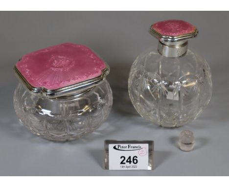 Early 20th century Mappin &amp; Webb silver topped and pink enamel ladies scent bottle of globular form, together with a matc