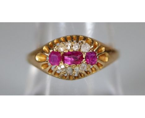 Yellow metal ruby and diamond ring.  Ring size O&1/2.  Approx weight 2 grams.(B.P. 21% + VAT) 