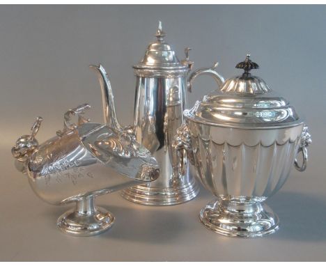 Collection of silver plate to include a lidded sugar scuttle and scoop, lion handled tea caddy, and a classical design coffee
