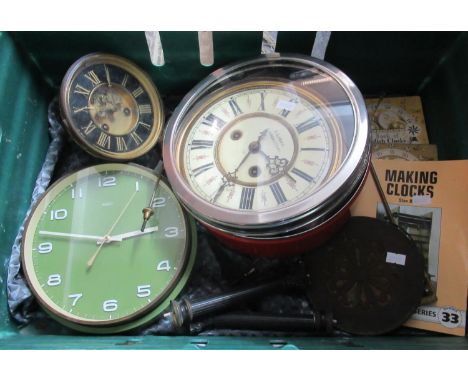 box of clock parts etc. Containing A Lyons of Abergavenny Clock Face and movement, a vintage green battery driven wall clock 