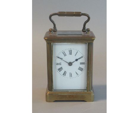 Brass French carriage clock with white enamel face and Roman numerals.(B.P. 21% + VAT) 