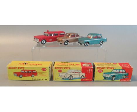 Three vintage Dinky toys Diecast model vehicles in original boxes to include 134 Triumph Vitesse, 257 Fire chief's car, and a